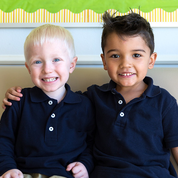 Two boys smiling for the picture